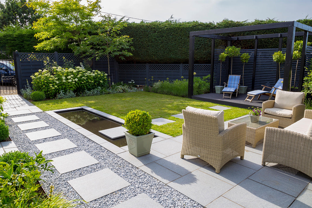 A modern garden design with a lawn, pergola, patio area and path.